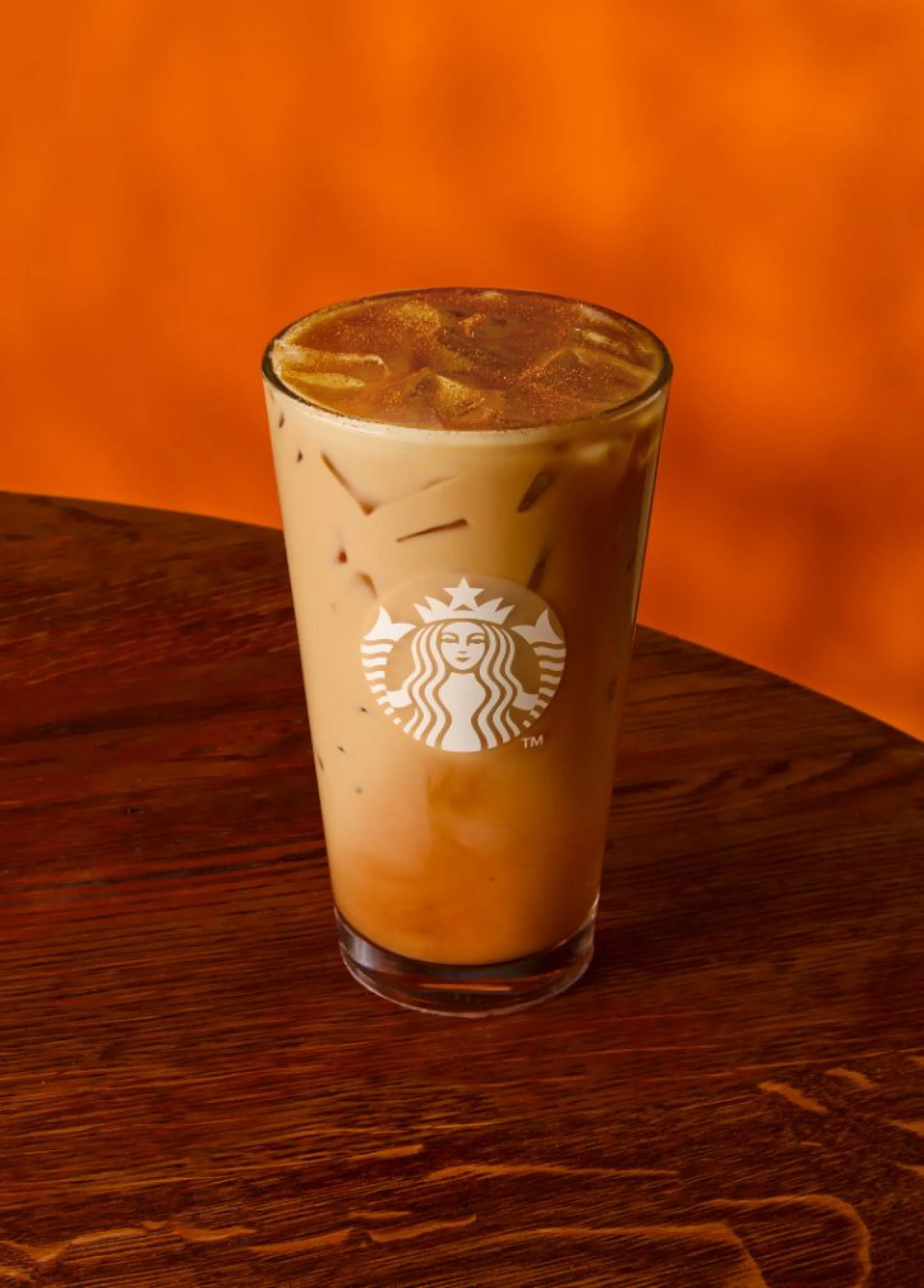 a picture of an iced pumpkin spice latte in a glass