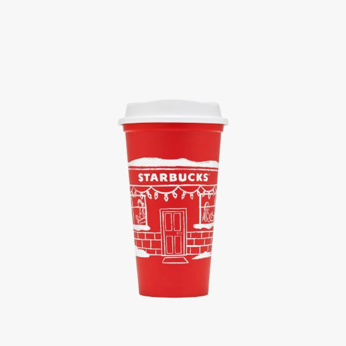 Červený opakovane použiteľný pohár (reusable cup) s bielym vrchnákom, s bielou kresbou vianočne osvetleného domčeka a nápisom Starbucks