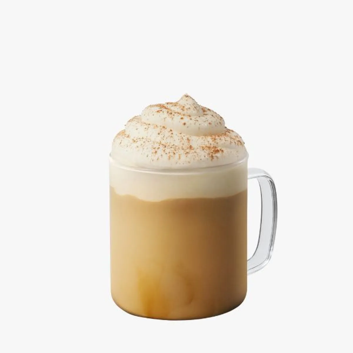 Light brown drink in a glass with whipped cream and cinnamon sprinkles