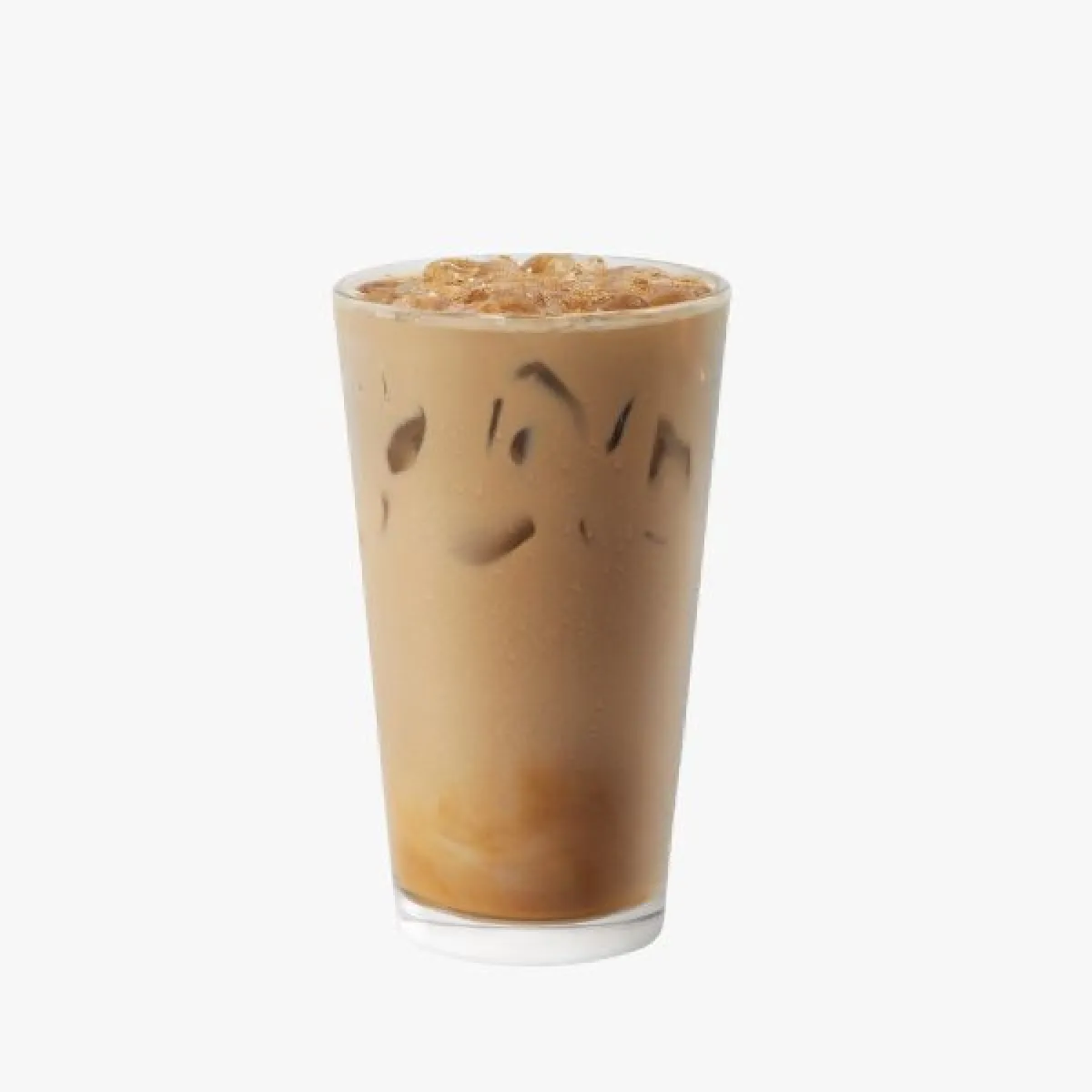 light brown drink in a glass, with ice, whipped cream, and sprinkles