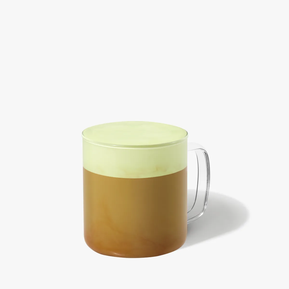 svetle hnedý nápoj so zelenou penou navrchu.