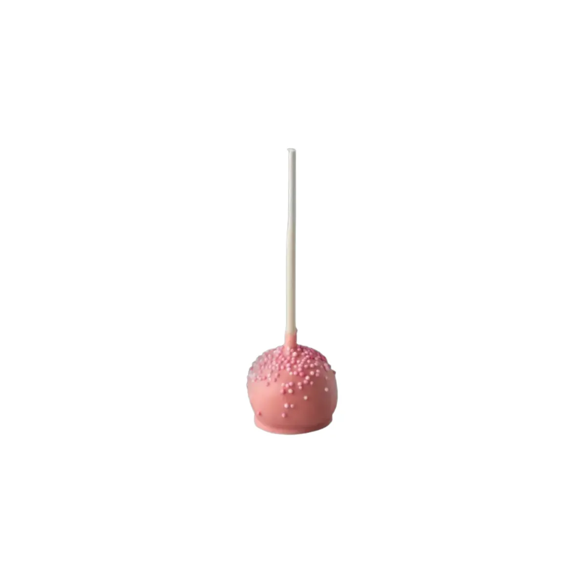 Ružový cake pop na tyčinke, posypaný drobnými cukrovými guličkami, s hladkým guľatým tvarom
